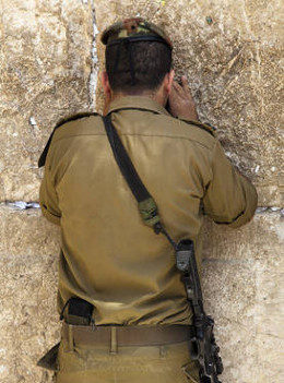 Israeli soldier praying at Wailing Wall