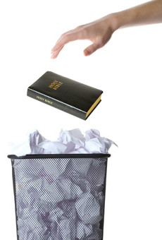 Tossing Bible in the trash