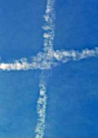 Vapor trails form cross