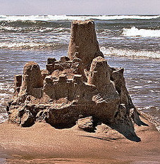 Sand castle getting washed away